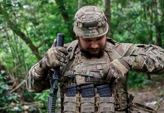 A Ukrainian serviceman takes part in anti-drone training at an undisclosed location near the frontline in the Kharkiv region